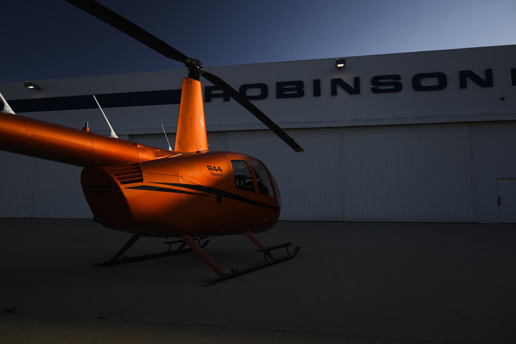 Robinson R44 Raven II outside the Robinson Helicopter factory at dusk